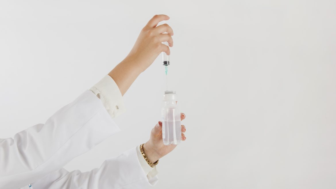 doctor-holding-syringe-test-tube