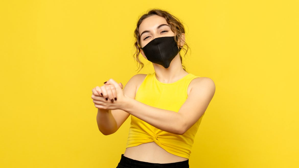 front view young girl with delighted face on yellow background virus emotion covid-