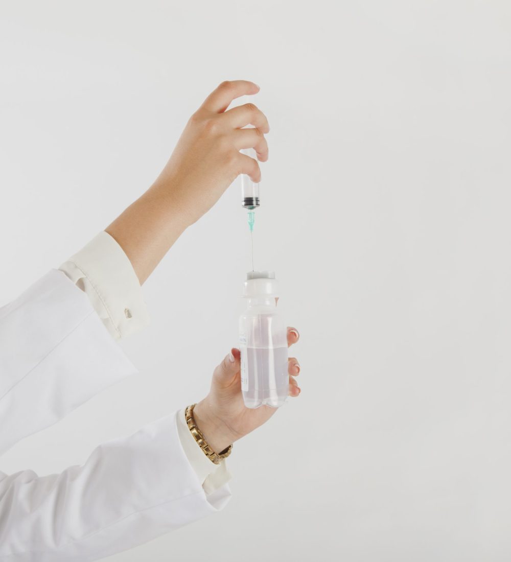 doctor-holding-syringe-test-tube
