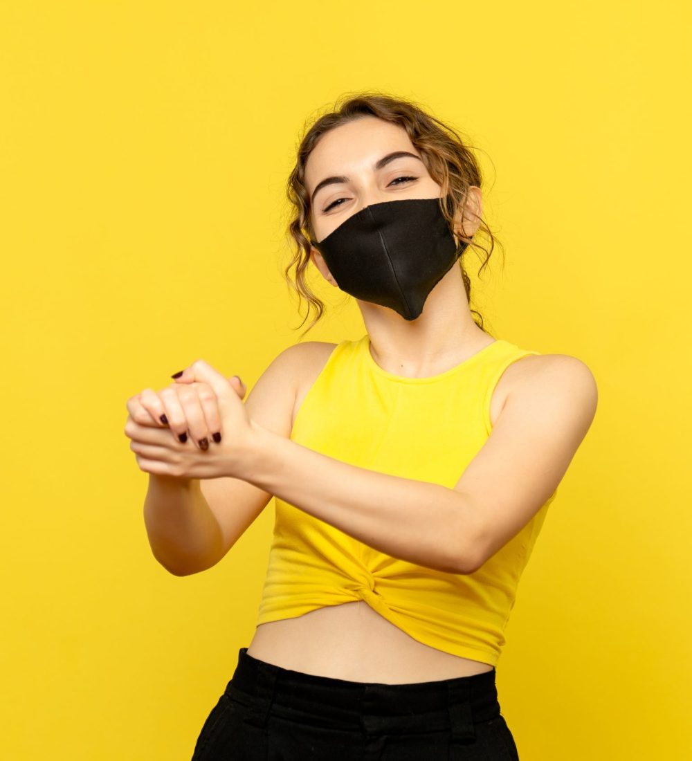 front view young girl with delighted face on yellow background virus emotion covid-